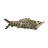 A Chinese silver gilt articulated fish pendant, set with turquoise eyes, inside of hinged mouth