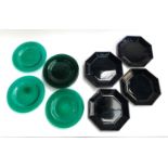 Eight green glass dishes, 21cmD; together with nine French black glass octagonal plates, 22cmD