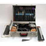 An aluminium flight case containing a quantity of bowling interest tools, dividers, reels, square