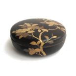 An early 20th century Japanese lacquered circular lidded box with gilt decoration, 23cmD