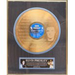 A framed and glazed special edition gold plated Elvis Presley Number 1 Hits disc, approx. 52x41.5cm