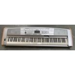 A Yamaha portable grand piano keyboard model DGX-500