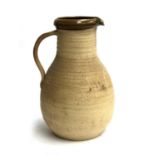 A Grindon studio pottery large earthenware jug, 39cm high, signed to base