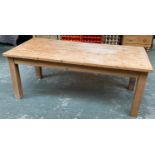 A large and sturdy 20th century pine kitchen table