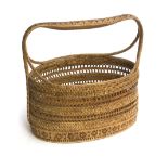 A cane and bamboo basket with handle