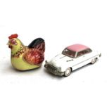 A vintage tin plate chicken, 15cmH; together with a model car