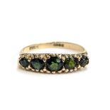 A 9ct gold tourmaline five stone ring, hallmarked for Birmingham 1976, size R 1/2, 2.6g