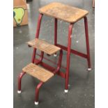 A 1950s red folding set of steps/stool