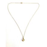 A 9ct gold modernist pendant set with a pearl, on a yellow metal chain, gross weight 1.9g