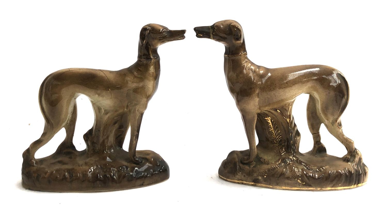 A pair of early 20th century Staffordshire dogs, (af), 17.5cmH