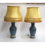 A pair of pale blue ceramic baluster form table lamps, with shades, 73cmH to top of shade