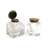 A pair of heavy square glass inkwells with brass hinged lids, 7.5cmH