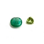 An approx. 2.1ct emerald together with a 0.6ct trillion cut peridot