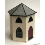 A hexagonal dolls house, 54cmH