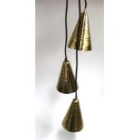 A beaten effect gilt metal pendant light trio, new in box, together with another, unboxed