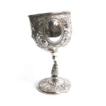 A silver plated communion cup, chased with foliage an vacant cartouche, AF, 19cmH