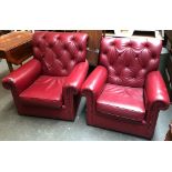 A pair of 20th century buttonback red leather club chairs, formerly of the Cavalry & Guards Club,