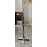 A wrought iron adjustable standard lamp, currently 160cmH (af)