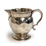 A George V silver milk jug, London 1919, 7.2cmH, 3.4ozt