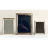A silver photo frame, hallmarked for R Carr, Sheffield, 1990, internal dimensions 18x13cm;