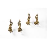 A set of four early 20th century gilt metal wall appliques in French late 18th century taste, each