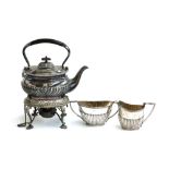 A three piece silver plated tea set, the milk jug marked Walker & Hall