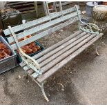 A slatted garden bench with cast iron ends