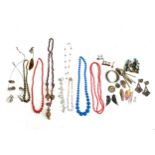 A large mixed lot of costume jewellery to include bead necklaces, cufflinks etc