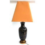 A ceramic japanned effect table lamp with peach coloured shade, 87cmH