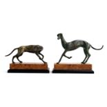 Interior design interest: a pair of vintage Korean Toyo bronze sculptures of long dogs on a burr