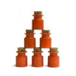 A lot of six orange ceramic Carlton, kitchen jars with cork stoppers, 8cmH