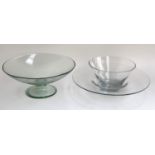 A large footed glass fruit bowl, 40cmD; together with two further large glass bowls (3)