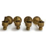 A set of four ormolu wall sconces with glass shades