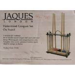 A Jaques Holmwood Croquet set on stand, boxed and unused