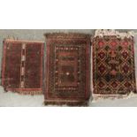 Three very small rugs, two approx. 70x47cm, the smaller 55x44cm (3)