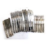 A mixed lot of silver handled flatware, comprising butter knives (5) and fruit forks (6) by C H