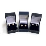 Three pairs of 9ct gold and cultured pearl stud earrings