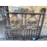 A pair of large wrought iron garden gates