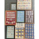 A quantity of framed and glazed cigarette cards and silks to include Kensitas, Godfrey Phillips BDV,