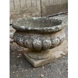 A composite stone garden urn planter, 39cmD, 30cmH