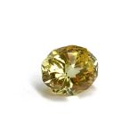 An unmounted yellow sapphire, mixed cut, measuring approx. 6ct, 11.7x9.4x7.6mm, 1.2g