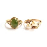 A 9ct gold ring set with a jadeite cabochon within a ropetwist border, size O, 2.1g; together with a