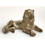 A filled 925 silver sculpture of a recumbent lion, 8.5cm high