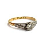 An early 20th century 18ct gold and platinum illusion set diamond ring, size M, 6 1/4, 1.6g