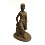 A patinated bronze resin figure of a seated nude, approx. 45cmH