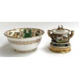 A Continental hand painted ceramic inkwell, painted with schloss, raised on four paw feet and a