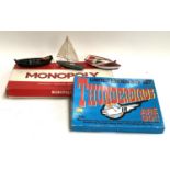 A vintage Monopoly board game, together with a Thunderbirds Limited Edition box set and wooden model