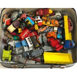 A suitcase containing a large quantity of die cast model vehicles and cars, to include Dinky, Corgi,