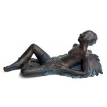 Ann Catherine Row (20th century British), cement fondue sculpture of a reclining angel, 69cm long