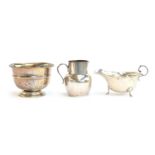 A small silver cream jug, London 1919; a George V sauce boat; and a polo club trophy rose bowl, 8.